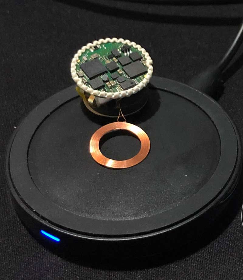 Smart-ball sensor circuit board, battery assembly, and wireless charging coil on a charging pad